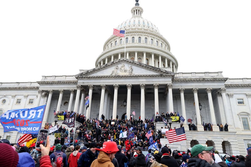 Protesters gather on the U.S. Capitol Building on January 06, 2021 in Washington, DC. Pro-Trump protesters entered the U.S. Capitol building after mass demonstrations in the nation's capital during a joint session Congress to ratify President-elect Joe Biden's 306-232 Electoral College win over President Donald Trump.
