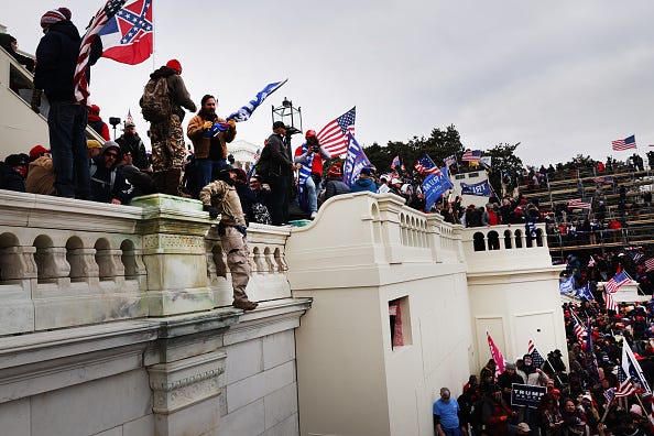 Thousands of Donald Trump supporters storm the United States Capitol building following a "Stop the Steal" rally on January 06, 2021 in Washington, DC. 