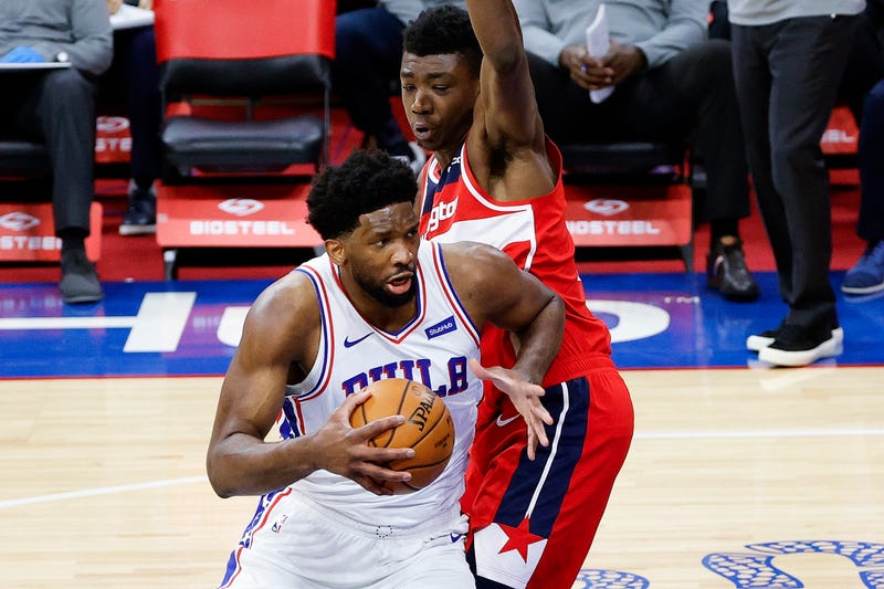 PHILADELPHIA, PENNSYLVANIA - JANUARY 06: Joel Embiid #21 of the Philadelphia 76ers drives past Thomas Bryant #13 of the Washington Wizards during the third quarter at Wells Fargo Center on January 06, 2021 in Philadelphia, Pennsylvania.