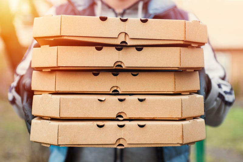 Man holding pizza boxes
