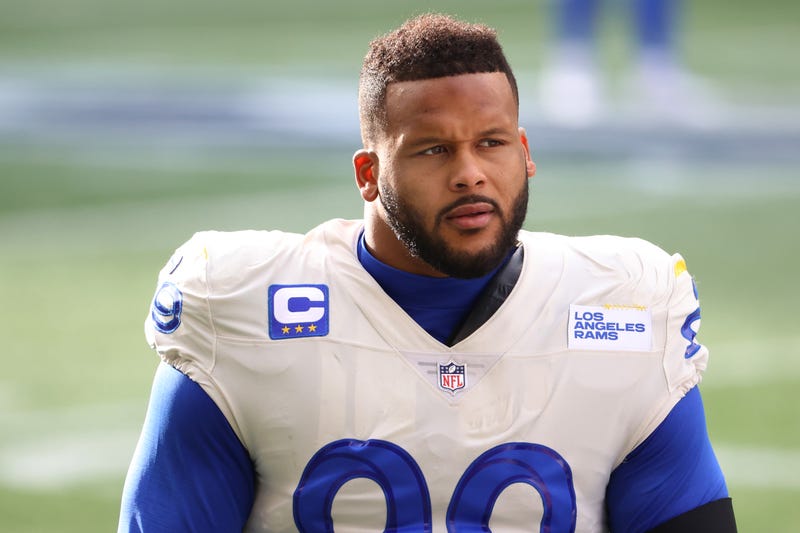 SEATTLE, WASHINGTON - JANUARY 09: Defensive end Aaron Donald #99 of the Los Angeles Rams looks on during pre-game activates prior to the NFC Wild Card Playoff game against the Seattle Seahawks at Lumen Field on January 09, 2021 in Seattle, Washington.