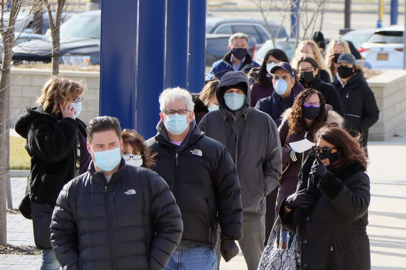 People line up for COVID-19 vaccinations at Nassau Community College on January 10, 2021 in Garden City, New York.