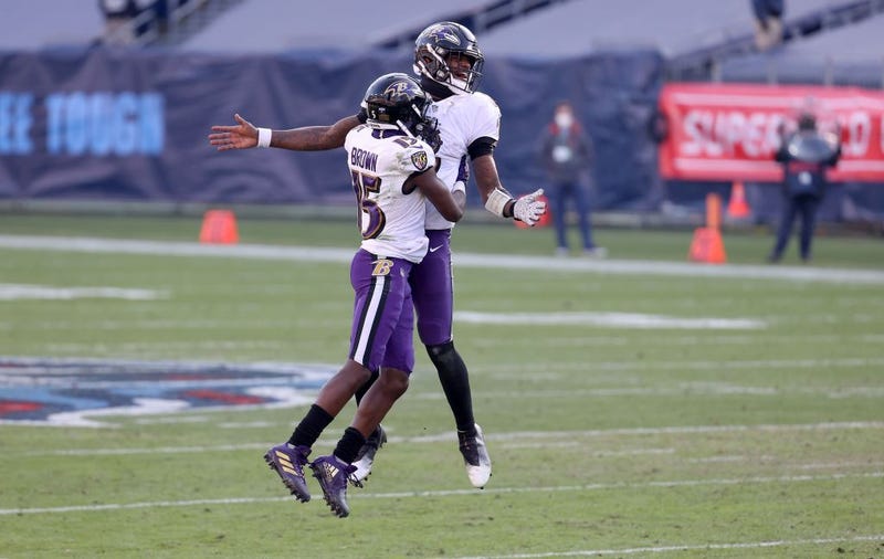 Lamar Jackson and Marquise Brown celebrate against the Titans.