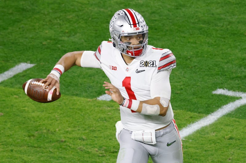 Ohio State quarterback Justin Fields about to attempt a pass.