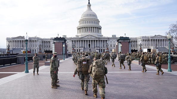Guard troops pour into Washington as states answer the call