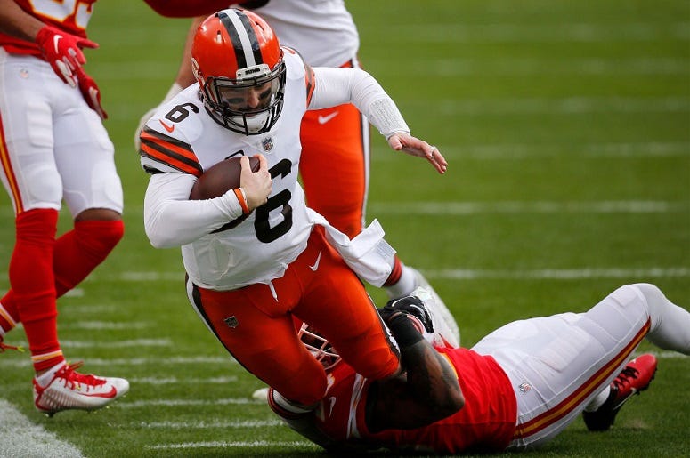Baker Mayfield is sacked by middle linebacker Anthony Hitchens during the first quarter of the AFC Divisional Playoff game