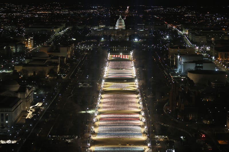 The "Field of Flags" is illuminated on the National Mall as the U.S Capitol Building is prepared for the inauguration ceremonies for President-elect Joe Biden on January 18, 2021 in Washington, DC. 