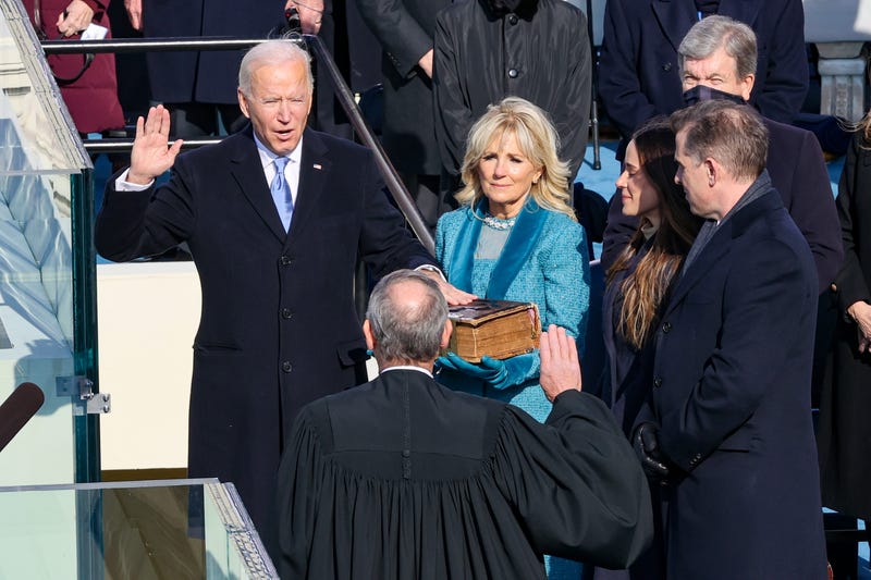  Joe Biden is sworn in as U.S. President during his inauguration on the West Front of the U.S. Capitol on January 20, 2021 in Washington, DC. During today's inauguration ceremony Joe Biden becomes the 46th president of the United States.