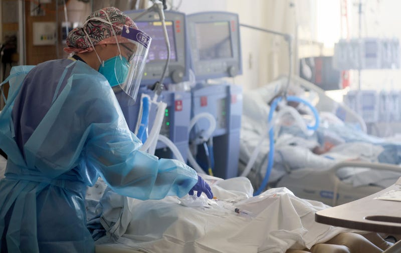 A registered nurse, cares for COVID-19 patients in a makeshift ICU at Harbor-UCLA Medical Center on January 21, 2021 in Torrance, California.