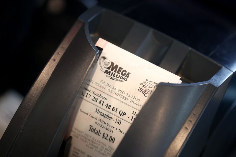 A customer purchases a Mega Millions lottery ticket.