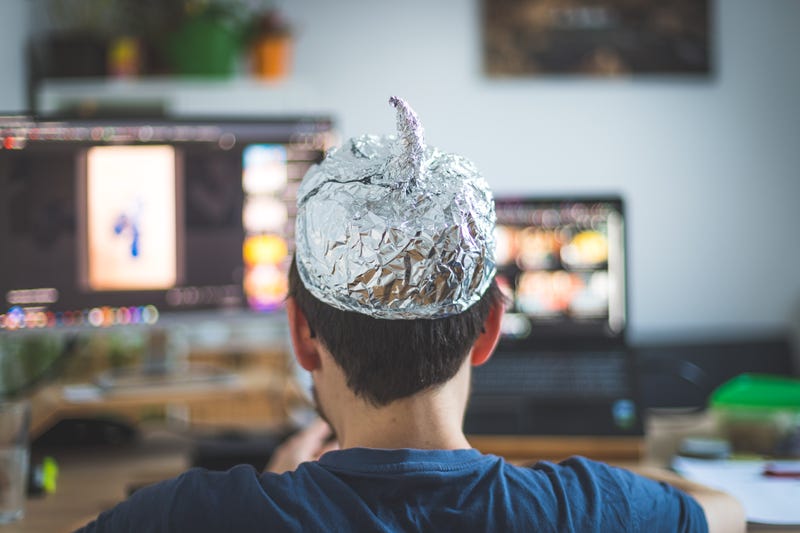 person wearing a tin foil hat