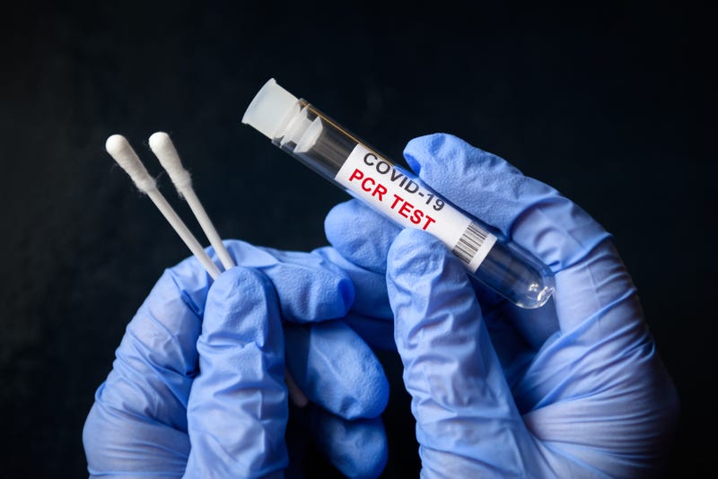 COVID-19 swab collection kit in doctor hands