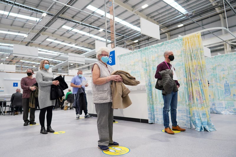 Priority patients wait to receive the AstraZeneca/Oxford University Covid-19 Vaccine as they attend the NHS Nightingale North East hospital on January 26, 2021 in Sunderland, England.