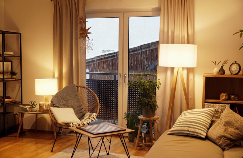 living room with warm lighting and a chess board on the table