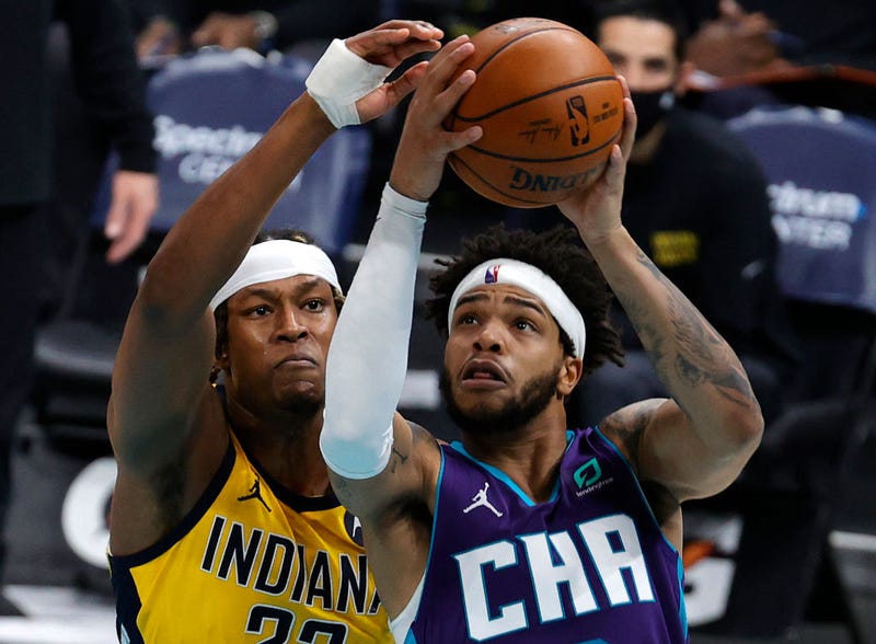 Myles Turner attempts to block Miles Bridges