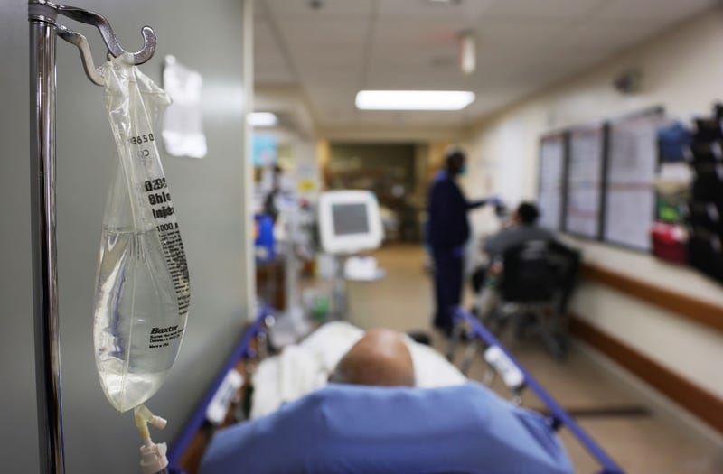 Patients rest in a hallway in the overloaded Emergency Room area at Providence St. Mary Medical Center on January 27, 2021 in Apple Valley, California.