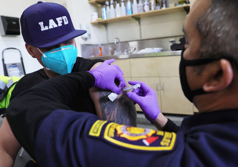 LAFD firefighter receiving COVID-19 vaccine.
