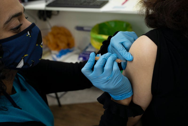 Patients receive the AstraZeneca COVID-19 vaccine at Copes pharmacy in Streatham
