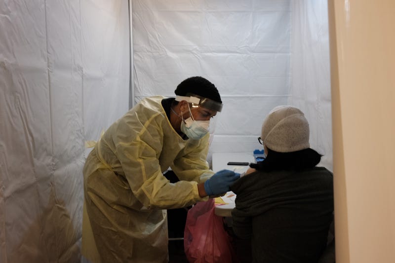 File photo: People receive a COVID-19 vaccination shot at a pop-up vaccination site at a Bronx church on February 04, 2021 in New York City