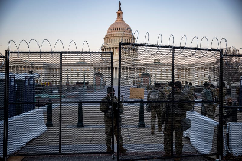 Barbed wire fences and National Guard troops surround the U.S. Capitol since the Jan. 6 attack by followers of then-President Donald Trump.