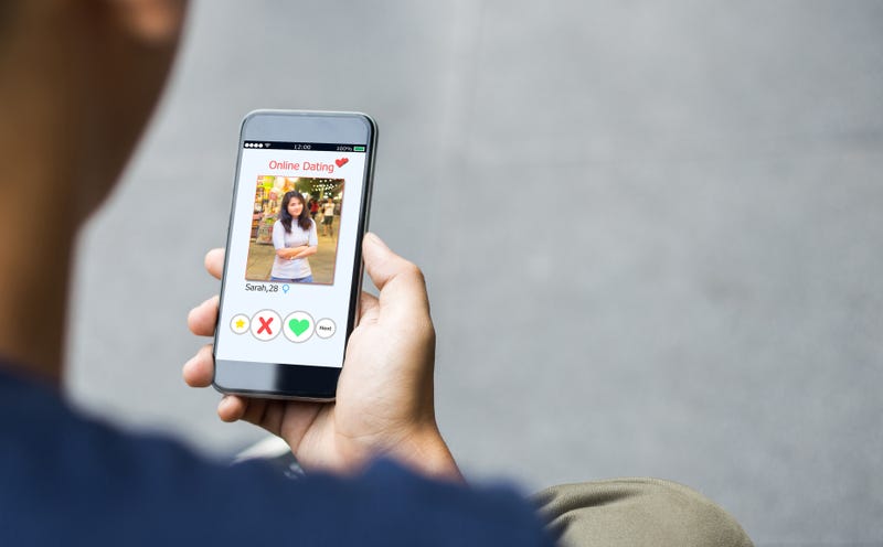 Stock photo of person using online dating app