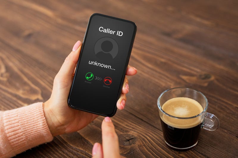 Person receiving a call from an unknown number. 