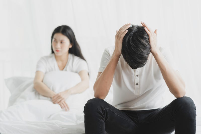 Couple quarreled, the man covered his ears not wanting to hear