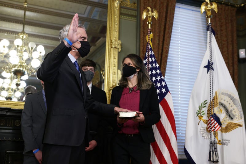 Former White House Chief of Staff Denis McDonough (L) is sworn in as the Secretary of the Department of Veterans Affairs as his wife Kari McDonough (R) looks on February 9, 2021 at Eisenhower Executive Office Building in Washington, DC. McDonough was confirmed by the U.S. Senate yesterday with an 87-7 vote. 