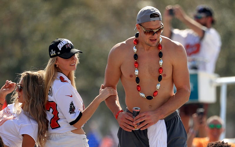 Rob Gronkowski #87 of the Tampa Bay Buccaneers and girlfriend Camille Kostek celebrates their Super Bowl LV victory during a boat parade through the city on February 10, 2021 in Tampa, Florida.