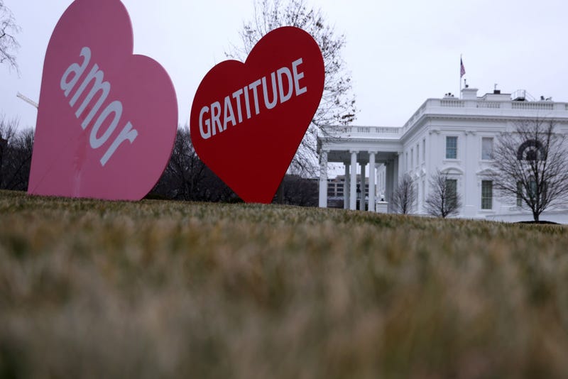 Heart-shape signs with Valentine messages are on display on the North Lawn of the White House February 12, 2021 in Washington, DC. The office of first lady Jill Biden set up the Valentine messages to the country overnight to mark Valentine’s Day. According to a media release, Valentine’s Day has always been one of the favorite holidays of the first lady.