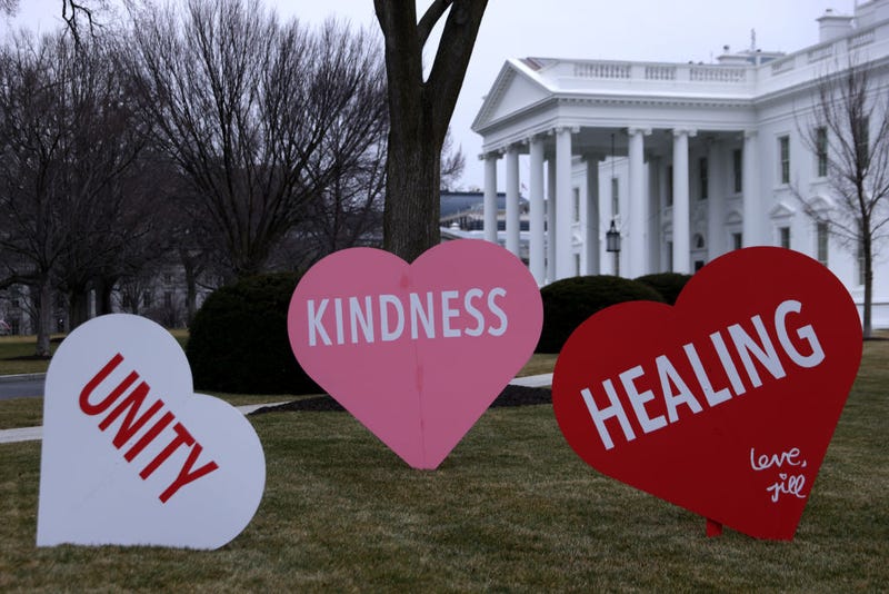 Heart-shape signs with Valentine messages are on display on the North Lawn of the White House February 12, 2021 in Washington, DC. The office of first lady Jill Biden set up the Valentine messages to the country overnight to mark Valentine’s Day. According to a media release, Valentine’s Day has always been one of the favorite holidays of the first lady.