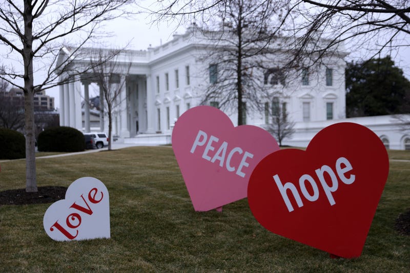 Heart-shape signs with Valentine messages are on display on the North Lawn of the White House February 12, 2021 in Washington, DC. The office of first lady Jill Biden set up the Valentine messages to the country overnight to mark Valentine’s Day. According to a media release, Valentine’s Day has always been one of the favorite holidays of the first lady.