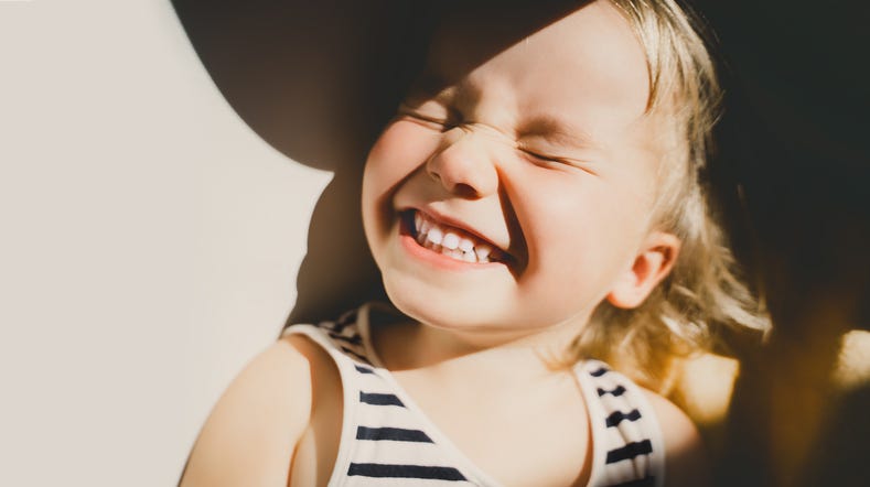 smiling girl under sunlight