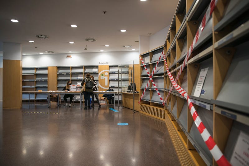 Empty bookshelves are seen in the electoral college of the Jaume Fuster Library during Catalonia's Regional Elections on February 14, 2021 in Barcelona, Spain. In a survey, a third of those chosen by a draw to perform the civic duty of running polling locations on election day said they are worried about the risk of Covid-19 contagion. Spain has been amongst the worst-hit nations by the Coronavirus pandemic, and although the average number of infections has fallen the death rate remains high. (Photo by Cesc Maymo/Getty Images)