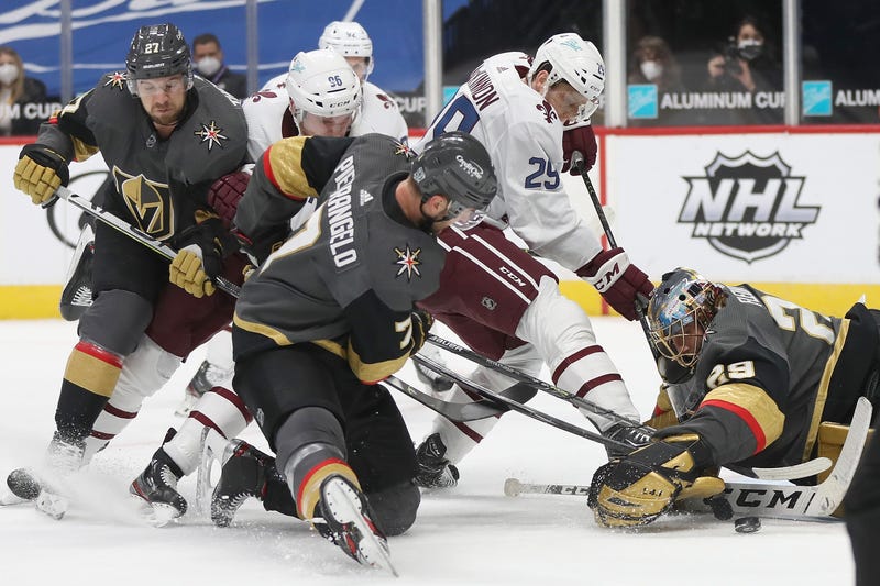 Goalie Marc-Andre Fleury #29 of the Las Vegas Knights makes a save against Nathan MacKinnon #29 of the Colorado Avalanche in the second period at Ball Arena on February 22, 2021 in Denver, Colorado.
