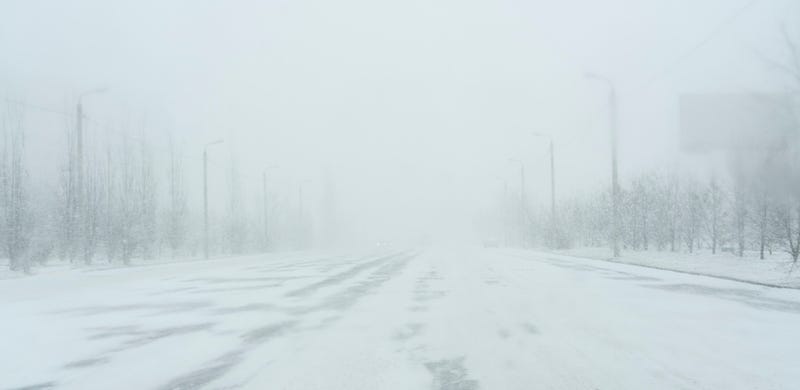 Snowfall in a city. 