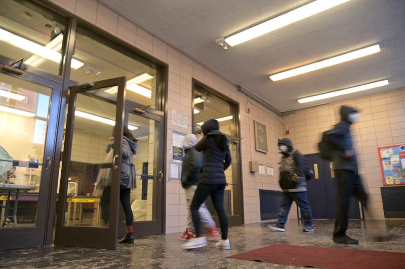 Students enter a Lower Manhattan public school in February 2021.