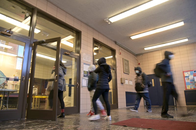 Student enter Sun Yat Sen M.S. 131 on February 25, 2021 in New York City.