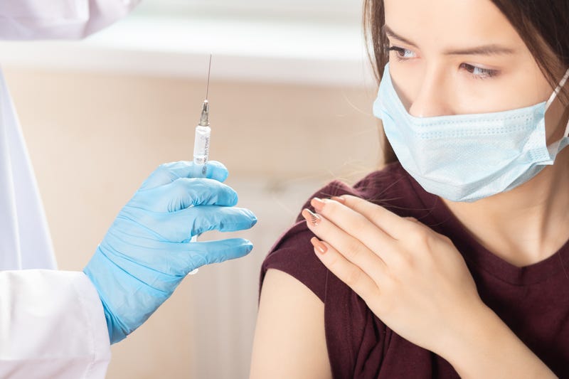 Student getting a vaccine. 