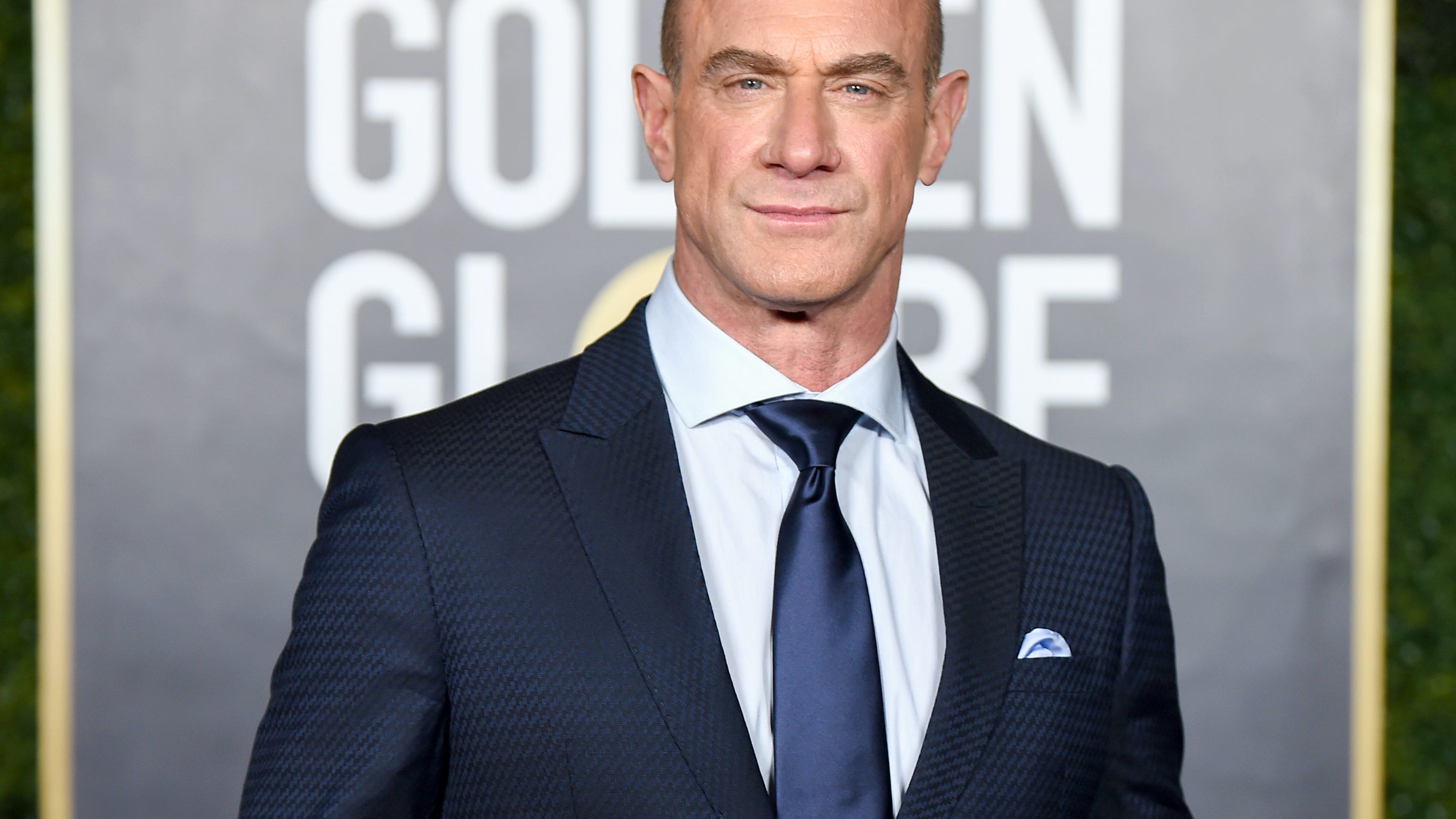 Christopher Meloni, 60, flaunts his buff biceps and six-pack abs in a crop top