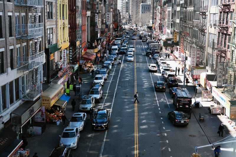 People walk through the streets of Chinatown on March 02, 2021 in New York City