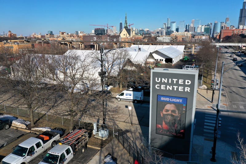 An aerial photo shot with a drone shows a COVID-19 vaccination center being constructed in a parking lot at the United Center, home to the NBA Chicago Bulls and NHL Blackhawks, on March 02, 2021 in Chicago, Illinois. The site is projected to distribute 6,000 vaccines-per-day once it begins operation next week.