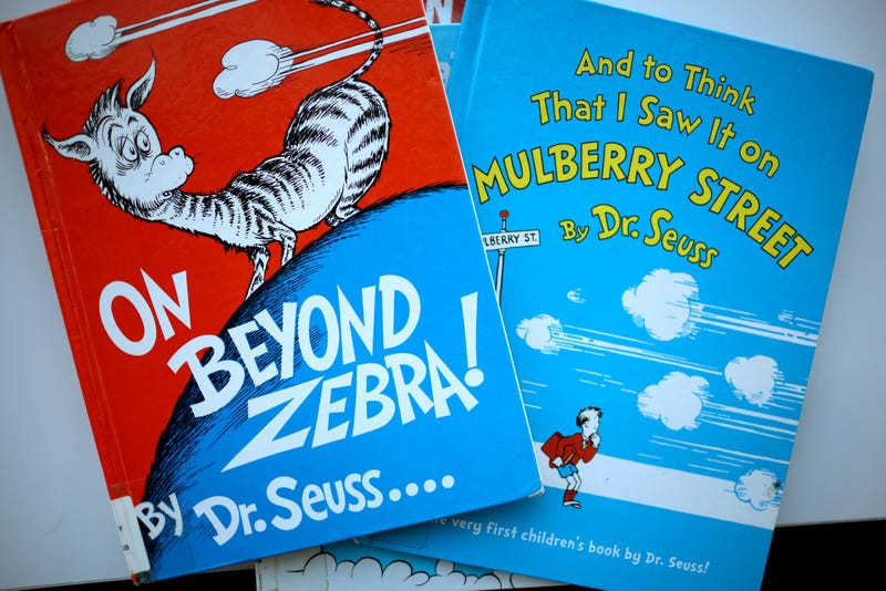 CHICAGO, ILLINOIS - MARCH 02: Books by Theodor Seuss Geisel, aka Dr. Seuss, including "On Beyond Zebra!" and "And to Think That I Saw it on Mulberry Street," are offered for loan at the Chinatown Branch of the Chicago Public Library on March 02, 2021 in Chicago, Illinois. The two titles are among six by the famed children's book author that will no longer be printed due to accusations of racist and insensitive imagery. The other titles include “If I Ran the Zoo,” “McElligot’s Pool,” “Scrambled Eggs Super!” and “The Cat’s Quizzer.”