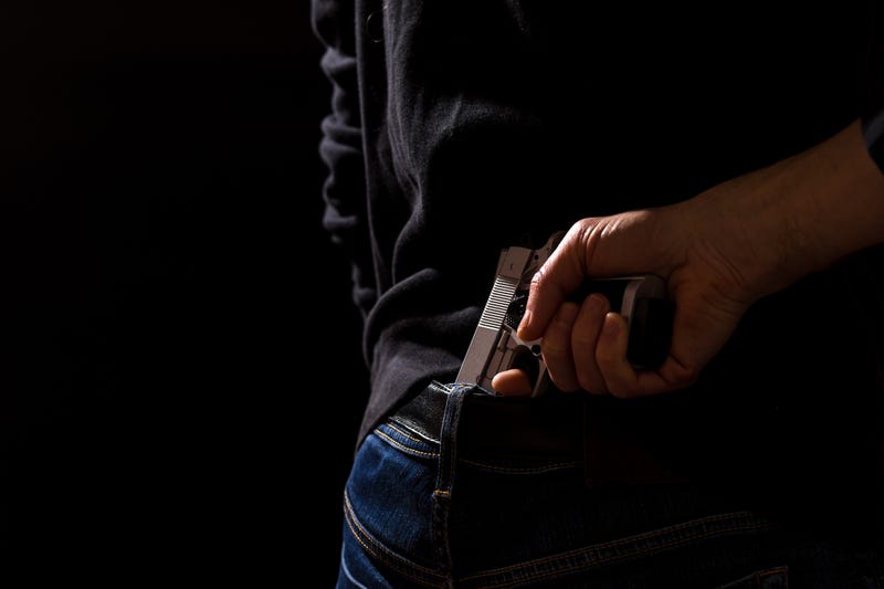 Person with gun.