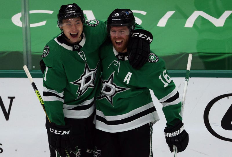 Jason Robertson #21 and Joe Pavelski #16 of the Dallas Stars celebrate a goal against the Chicago Blackhawks in the second period at American Airlines Center on March 09, 2021