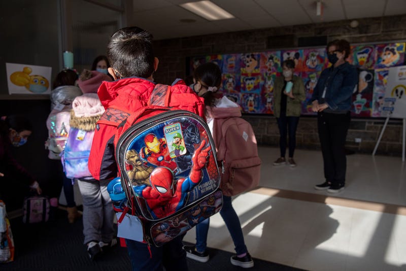 Students arrive for the first day of in-person learning for five days per week at Stark Elementary School on March 10, 2021 in Stamford, Connecticut.
