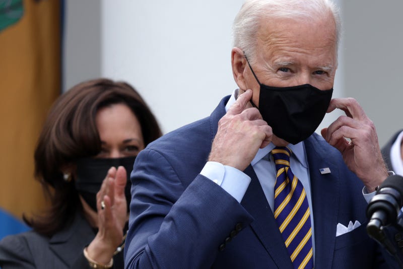 U.S. President Joe Biden speaks as Vice President Kamala Harris looks on during an event in the State Dining Room of the White House