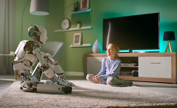 Girl speaking with robot friend at home