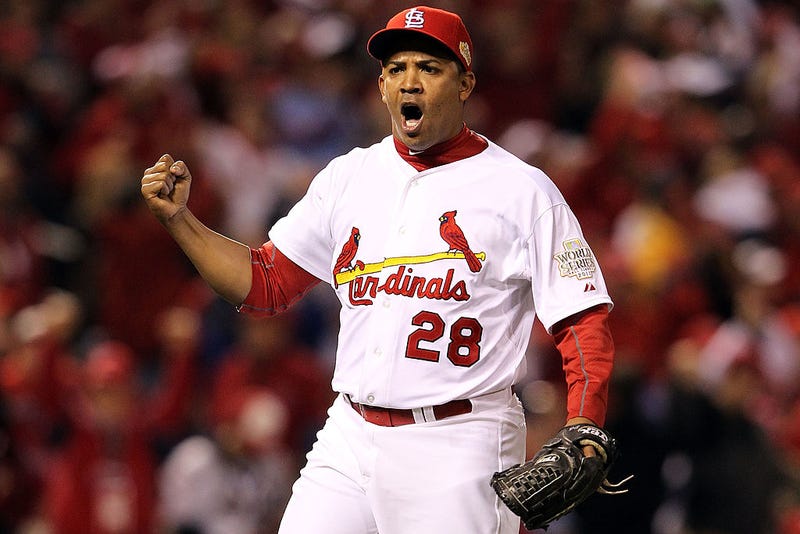 Octavio Dotel #28 of the St. Louis Cardinals celebrates after getting the third out of the seventh inning during Game Seven of the MLB World Series against the Texas Rangers at Busch Stadium on October 28, 2011 in St Louis, Missouri.