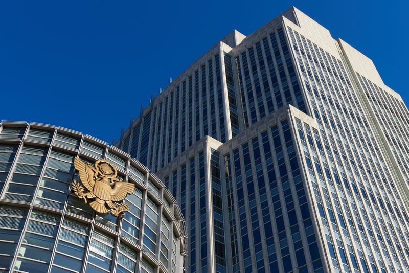 The Gold eagle, curved glass entry facade and tower of the Theodore Roosevelt United States Courthouse in Brooklyn Heights, NY.